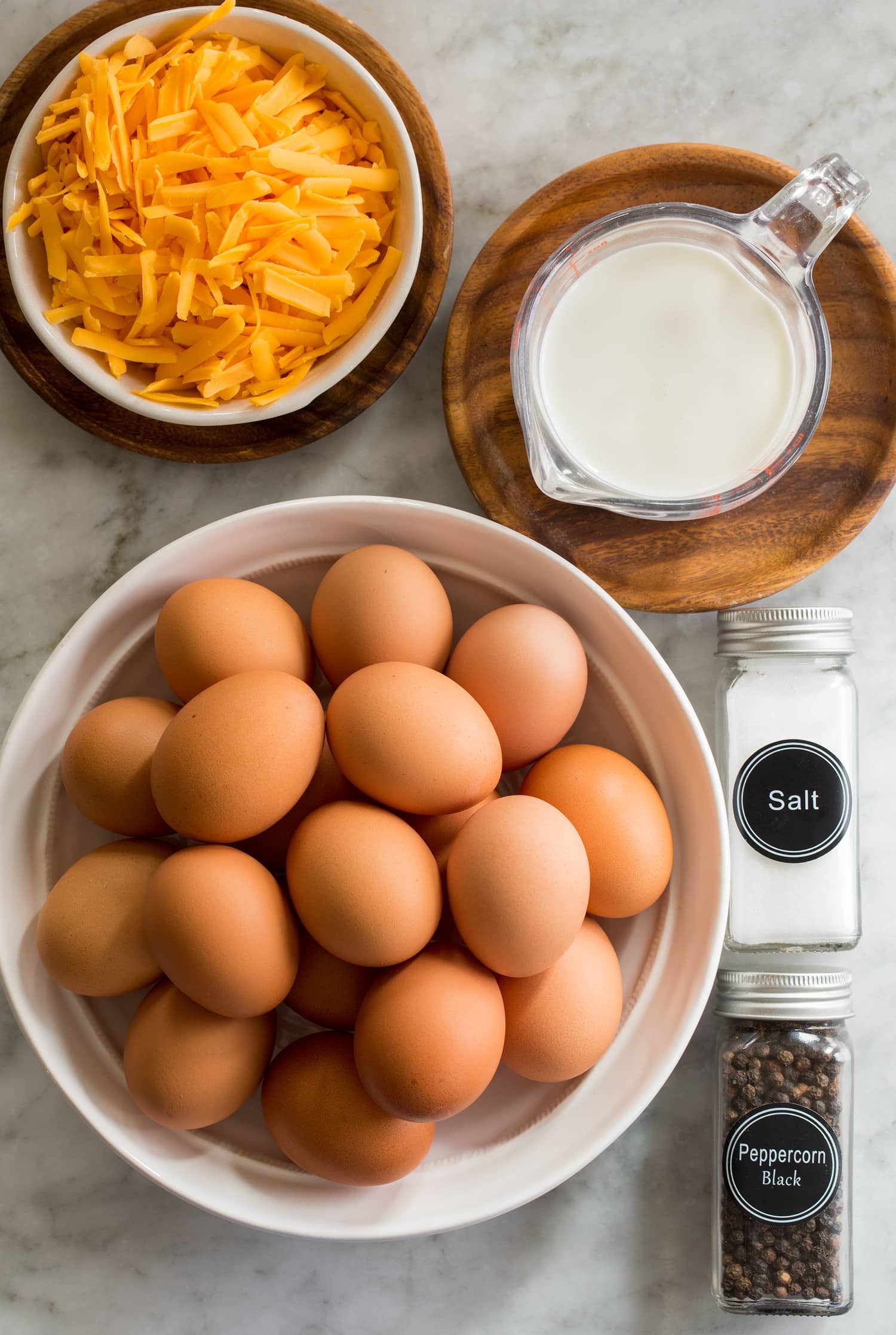 Sheet Pan Eggs Photo of ingredients including eggs, half and half, cheddar, salt and pepper.
