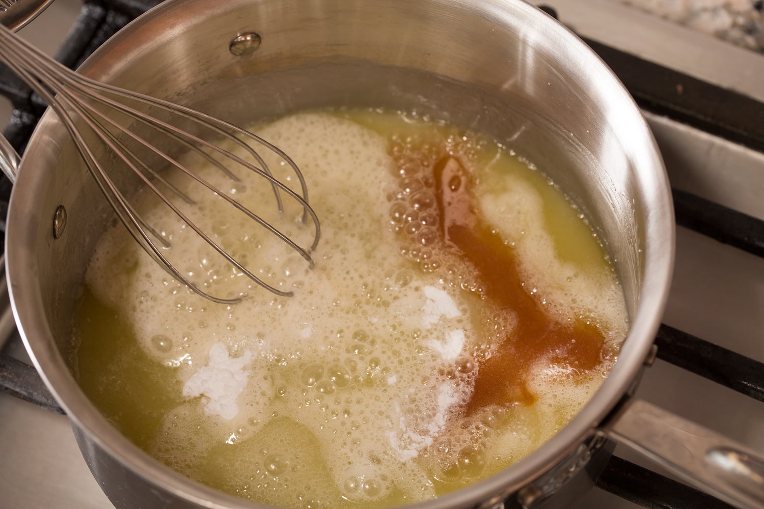 Buttermilk Syrup Baking soda and vanilla being added to syrup.