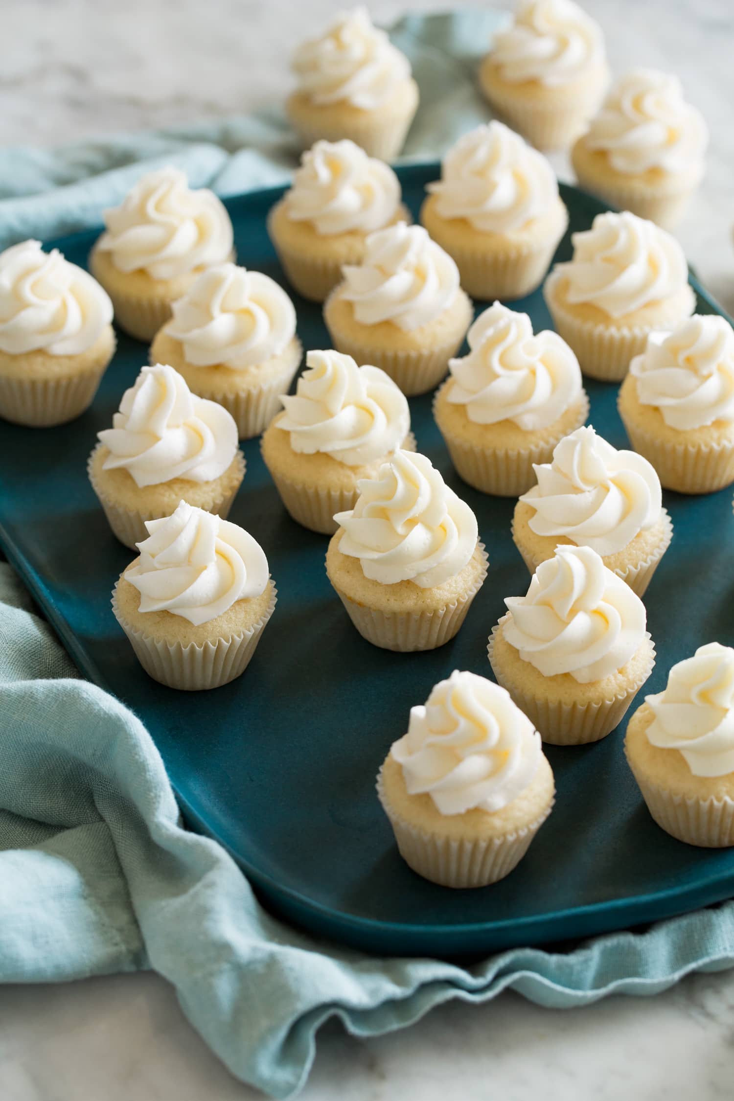 Mini Cupcakes Tray with lots of mini cupcakes with swirled frosting on top.