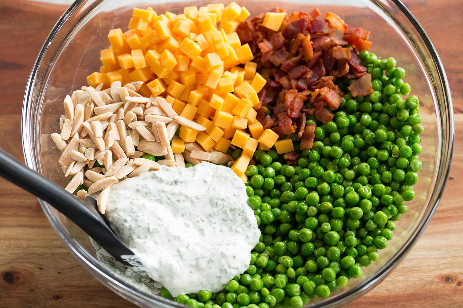 Pea Salad Pea salad prepared ingredients in a bowl shown before tossing.