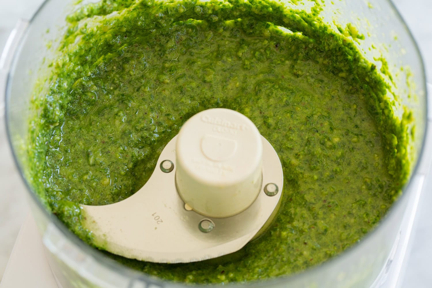Pesto Pasta Salad Completed basil pesto in a food processor.