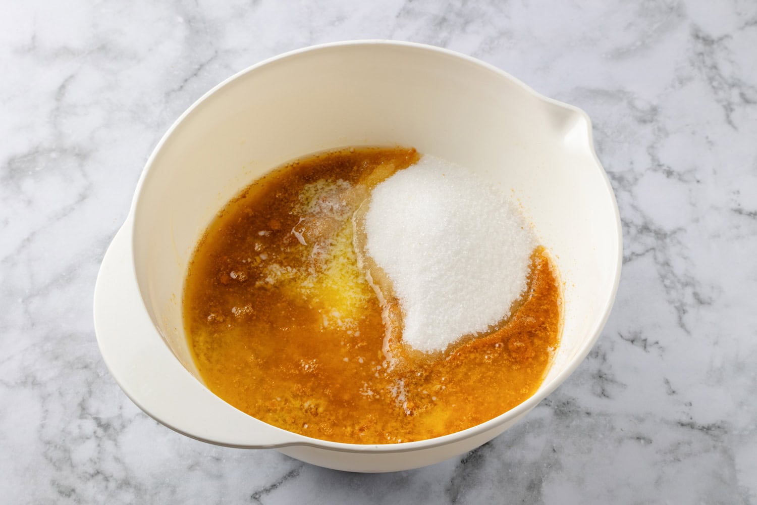 Lemon Icebox Pie Graham cracker crust mixture shown before mixing in a mixing bowl.