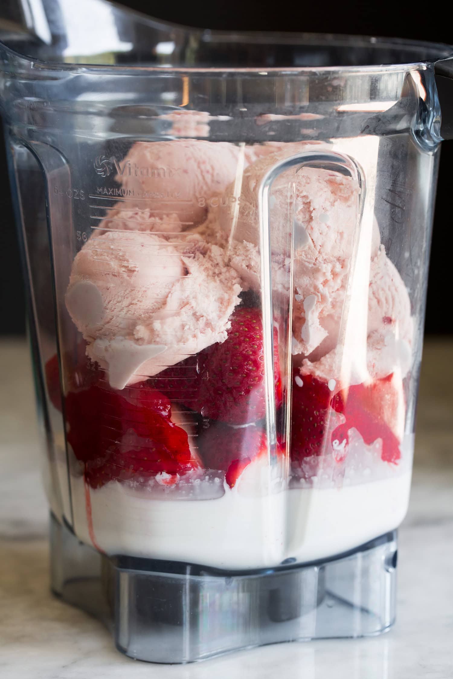 Strawberry Milkshakes Strawberry milkshake ingredients in blender before blending.