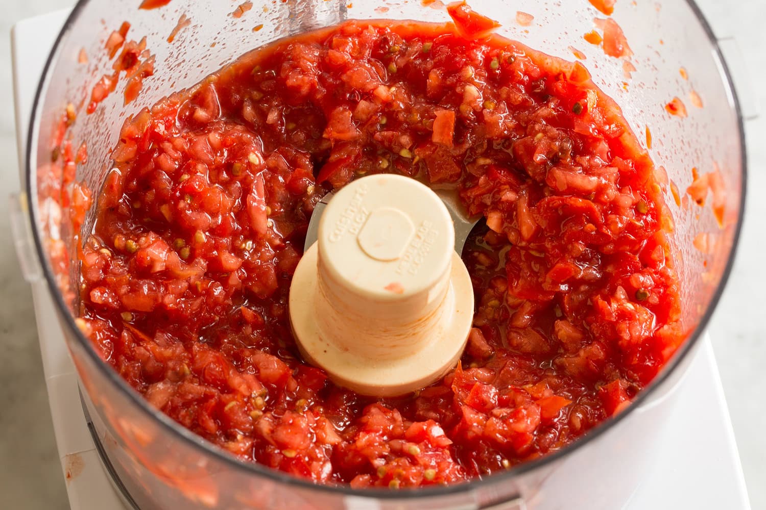 Huevos Rancheros Minced fresh tomatoes in food processor.