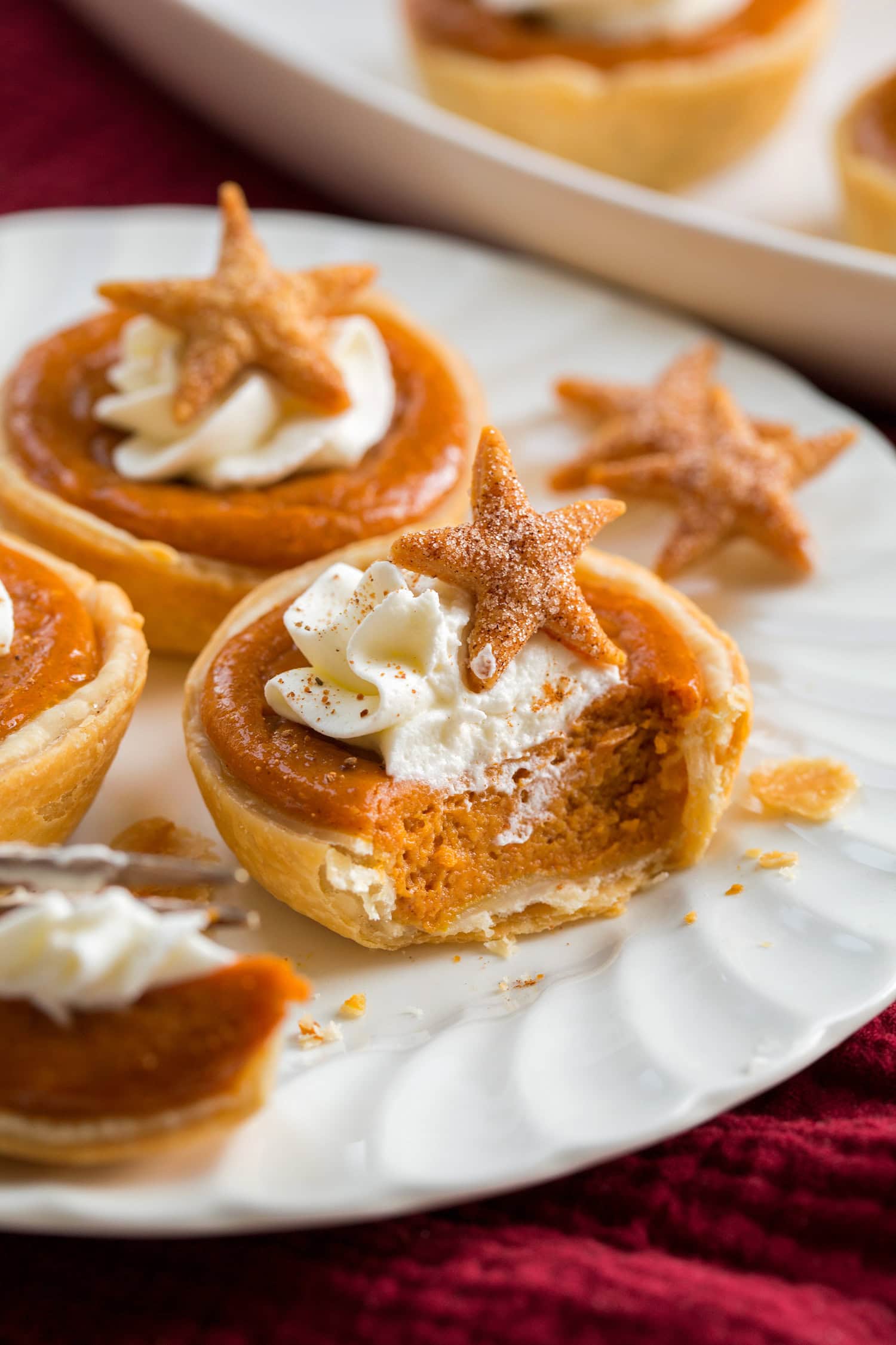 Mini Pumpkin Pies Mini pumpkin pie cut into with a fork showing interior texture.