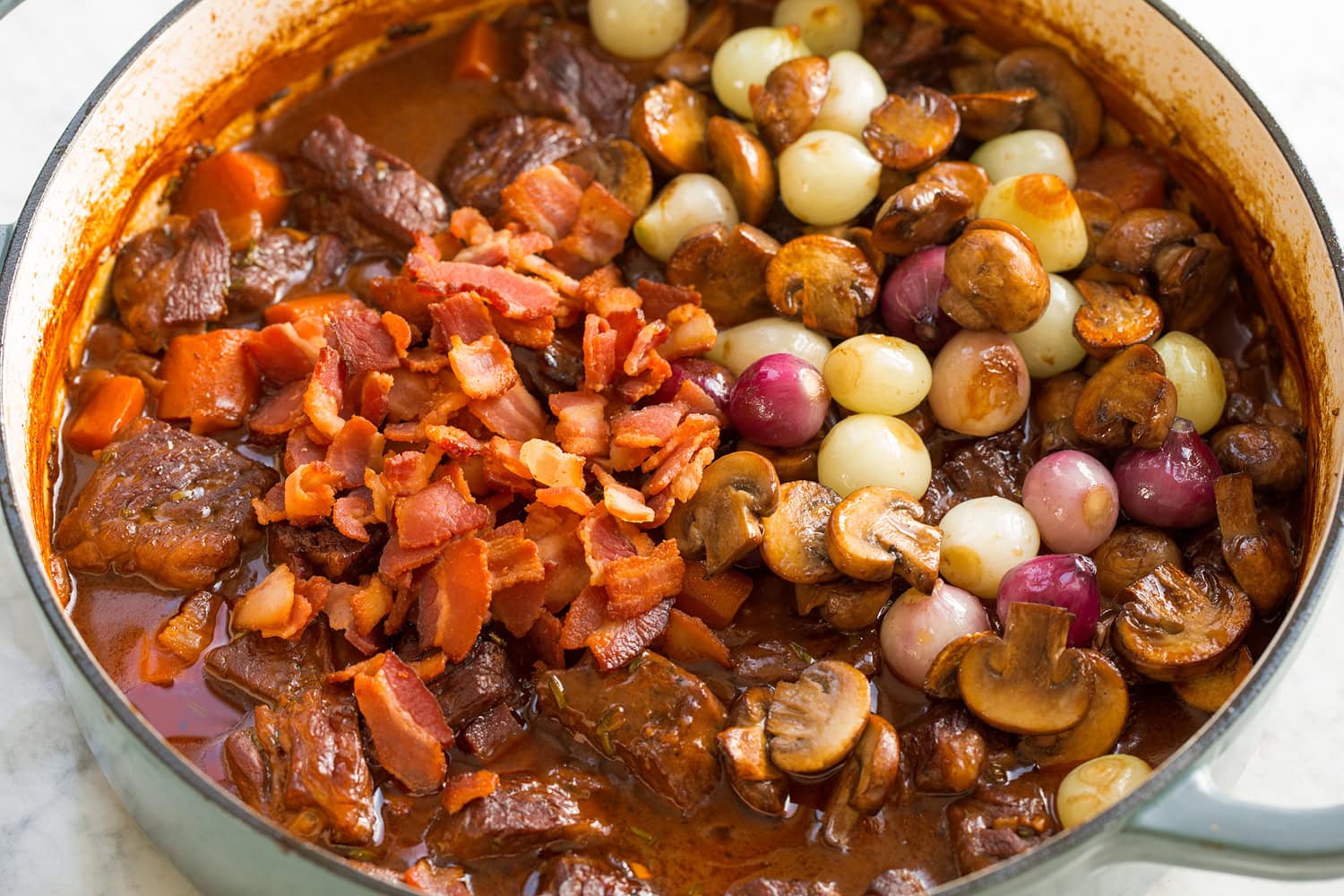 Beef Bourguignon Bacon, onions and mushrooms added to beef bourguignon.