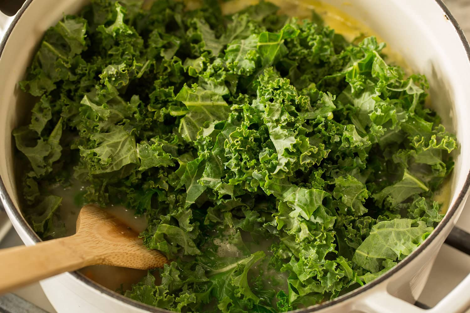 White Bean and Kale Soup Fresh kale added to pot of soup.