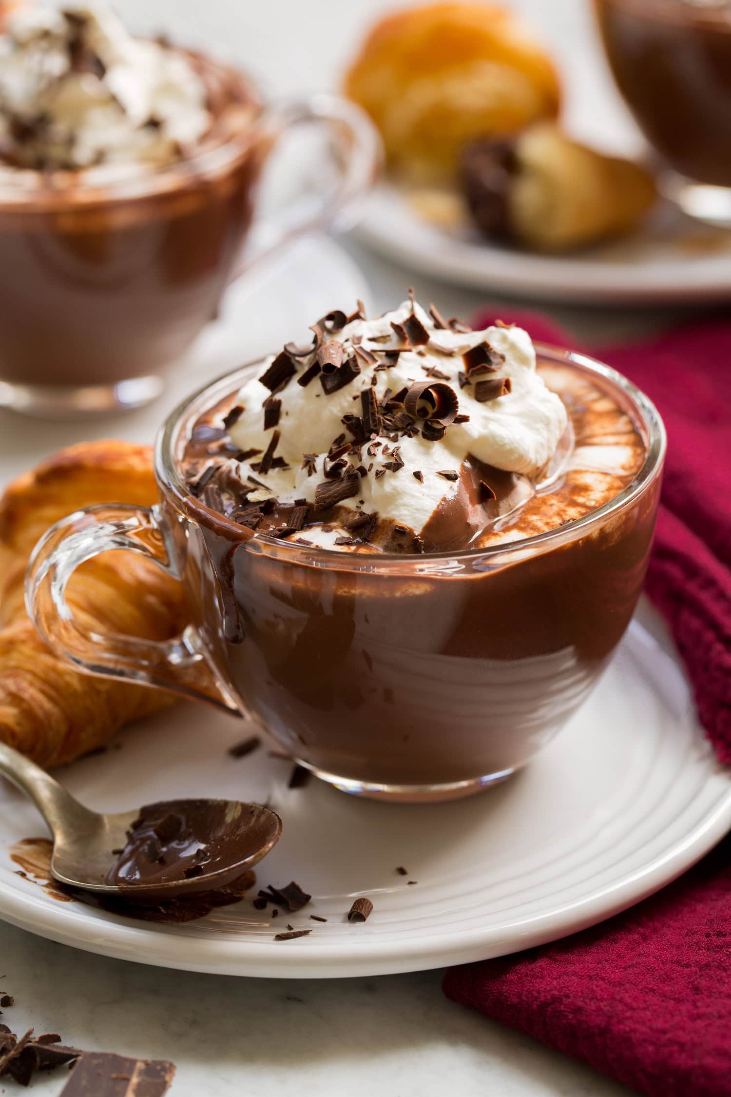 French Hot Chocolate French hot chocolate shown with whipped cream and chocolate shavings.