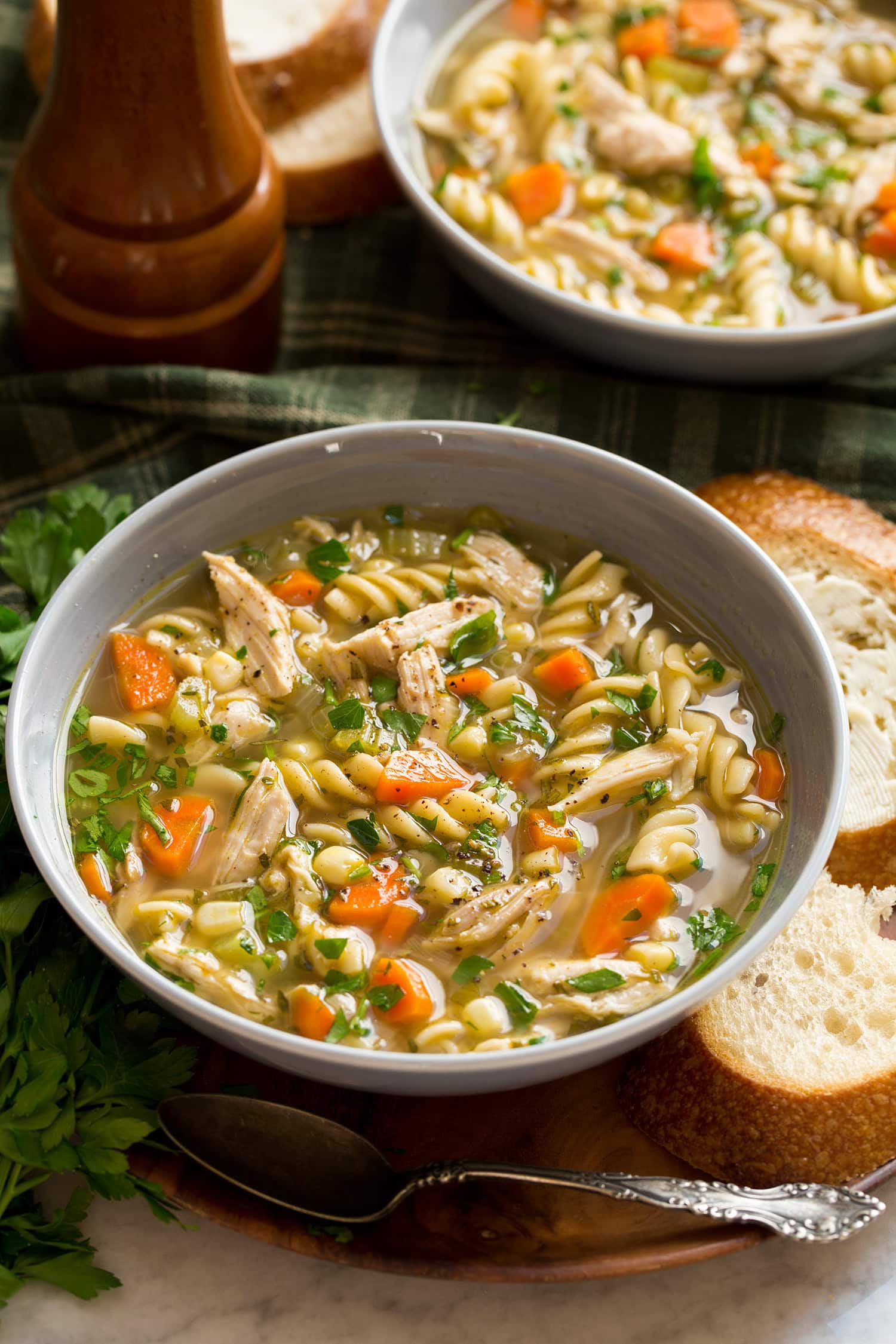 Turkey Soup Serving of turkey noodle soup in a grey bowl.