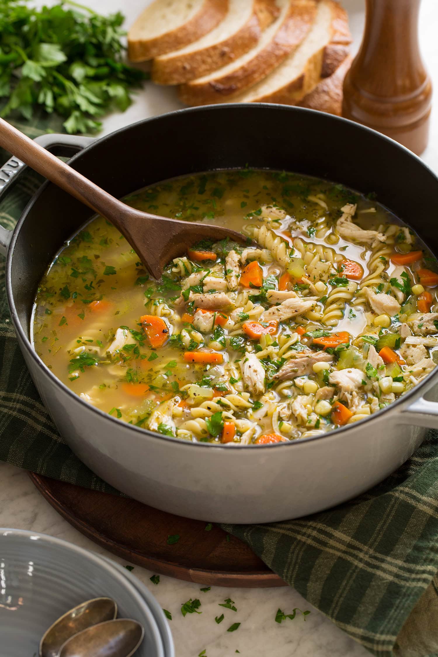 Pot filled with homemade turkey soup made from leftover turkey and carcass.